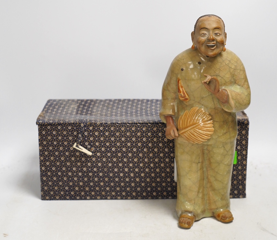 A Chinese Shiwan figure of a woman, mid 20th century, with box, 28cm high. Condition - poor to fair